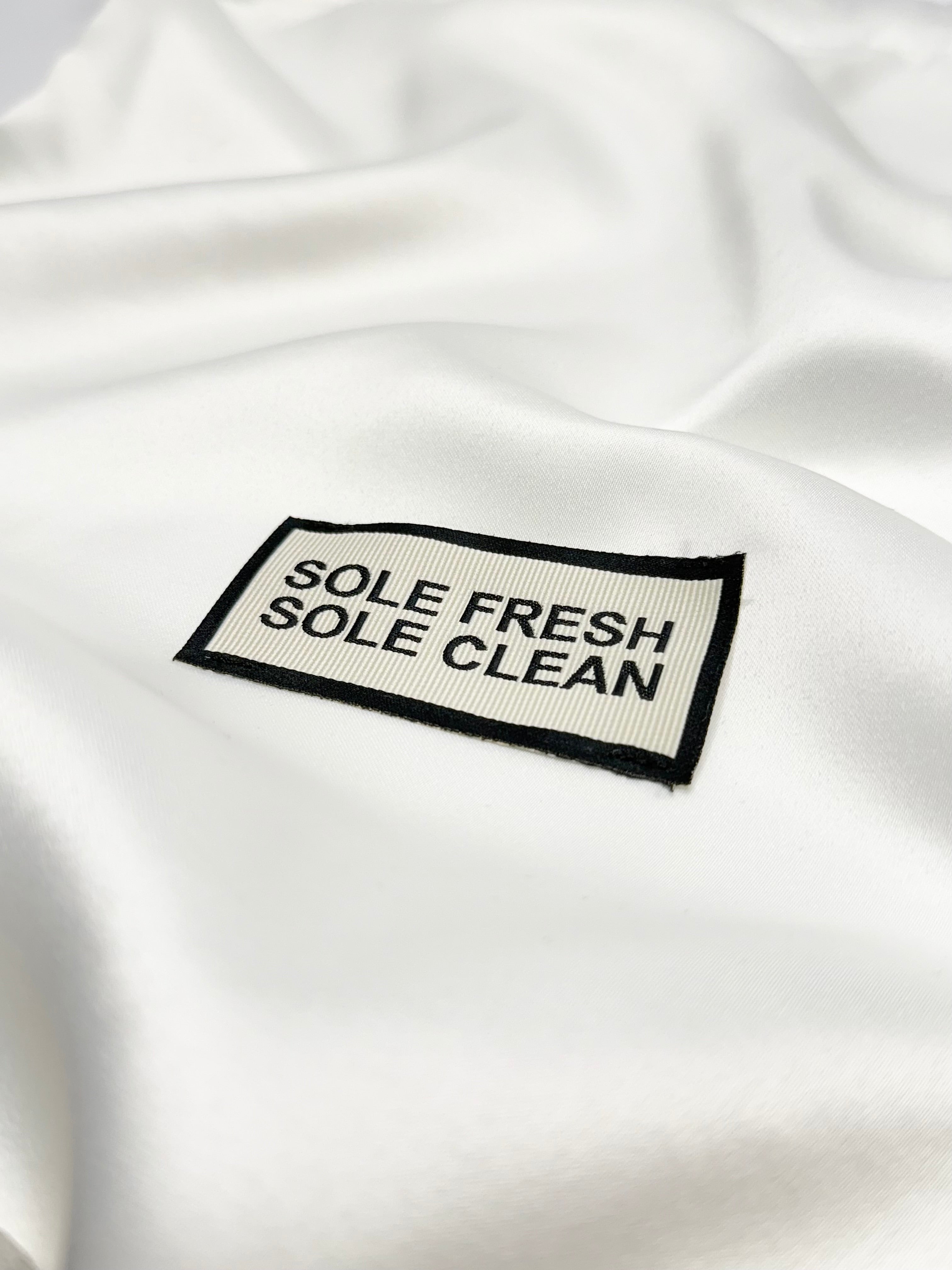 Sole Fresh & Sole Clean stitched branding on our luxurious premium sneaker dust bag, ensuring their pristine condition for storage or traveling. Enhancing your sneaker experience with sophistication and practicality.