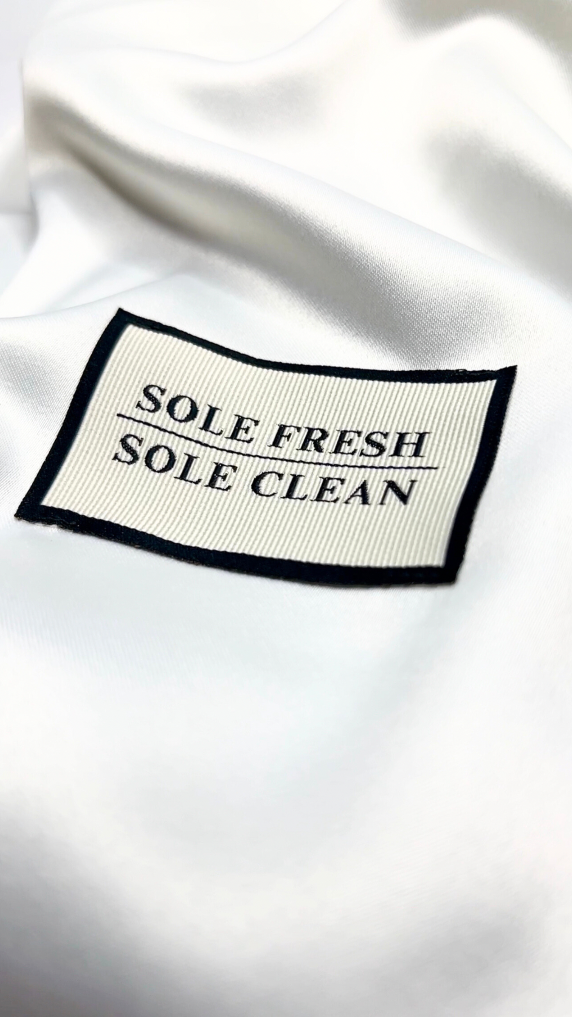 Sole Fresh & Sole Clean stitched branding on our luxurious premium sneaker dust bag, ensuring their pristine condition for storage or traveling. Enhancing your sneaker experience with sophistication and practicality.